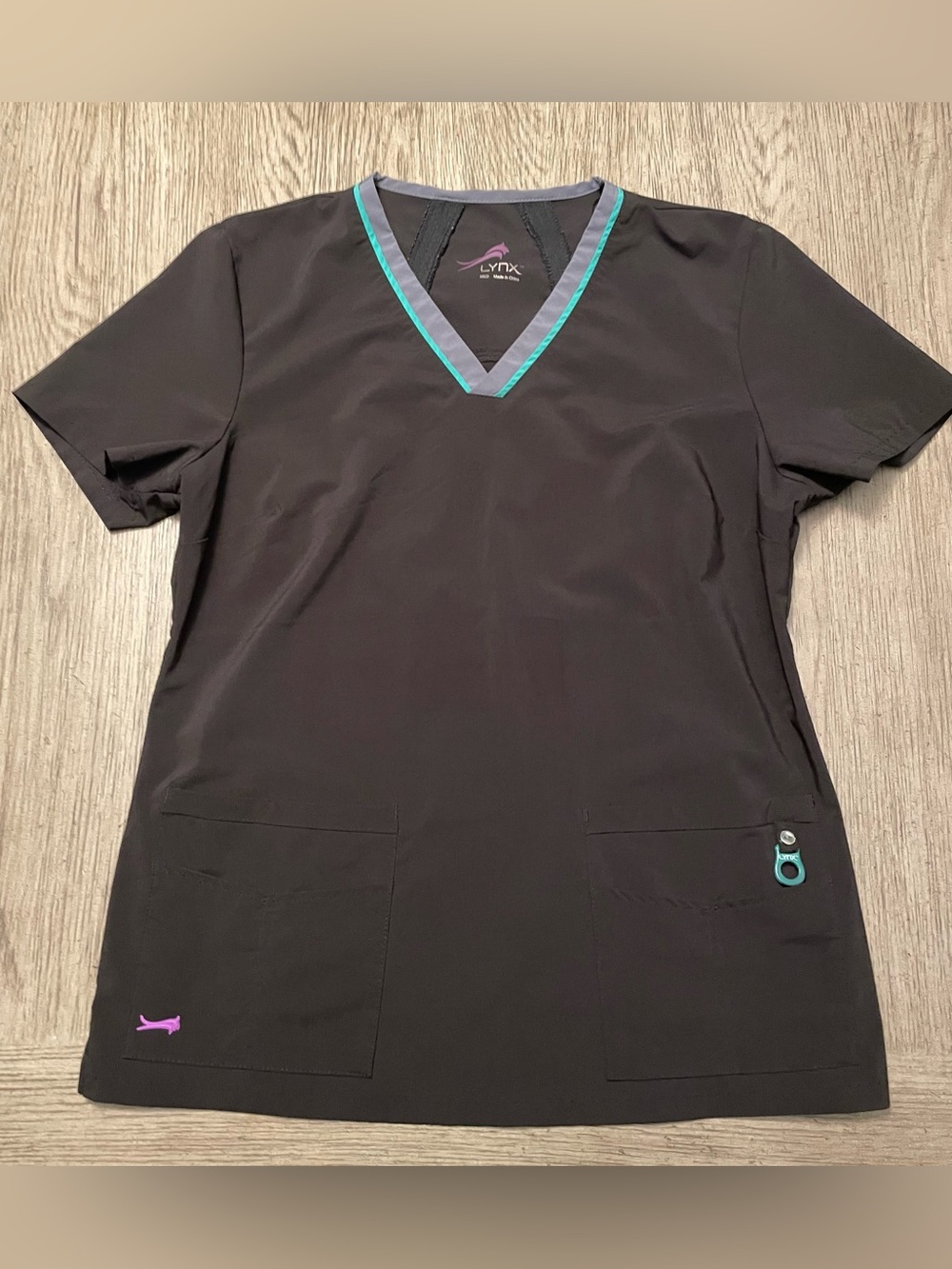 Lynx women’s scrub top, black with green collar detail, medium